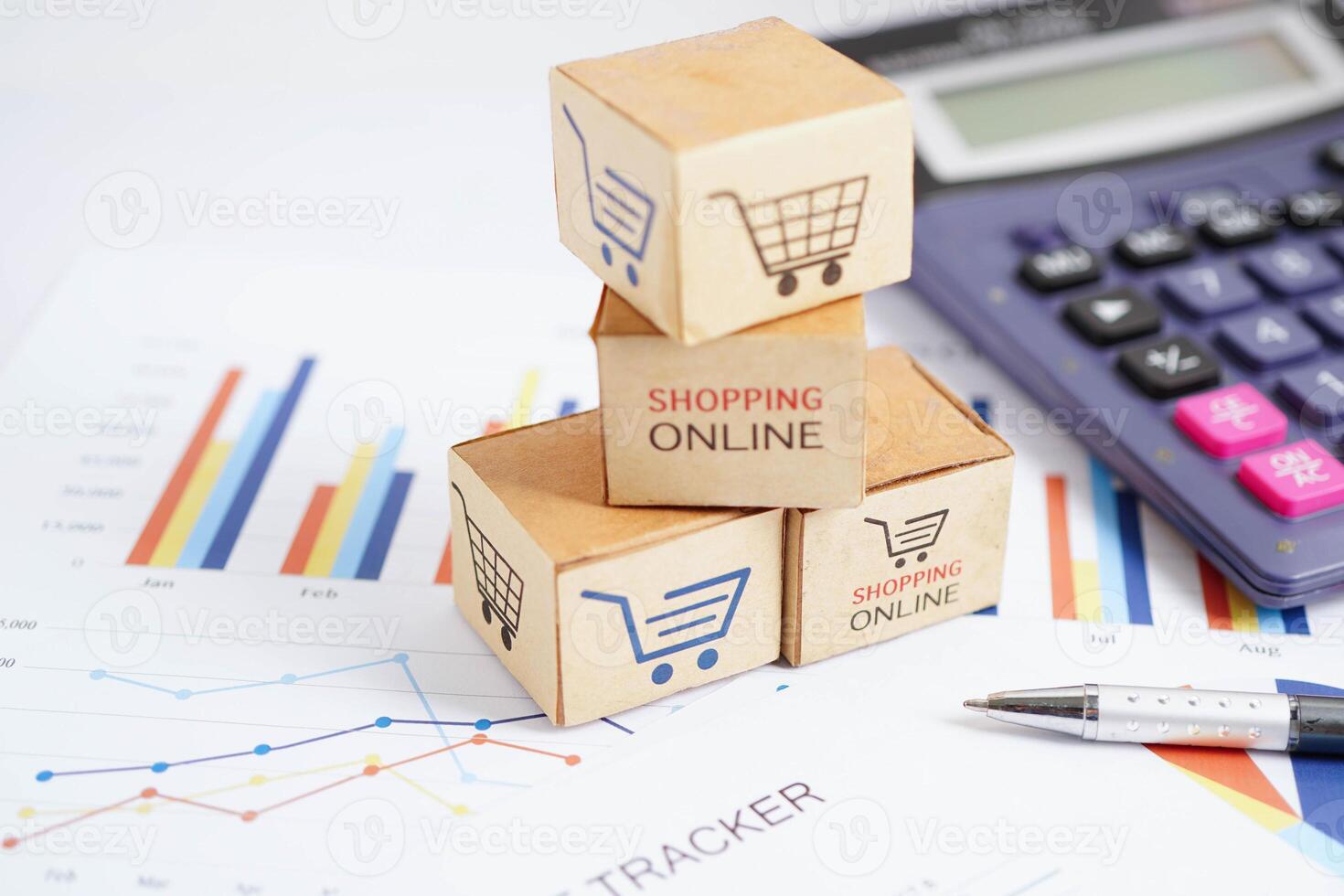 Online shopping, Shopping cart box on business graph, import export, finance commerce. photo