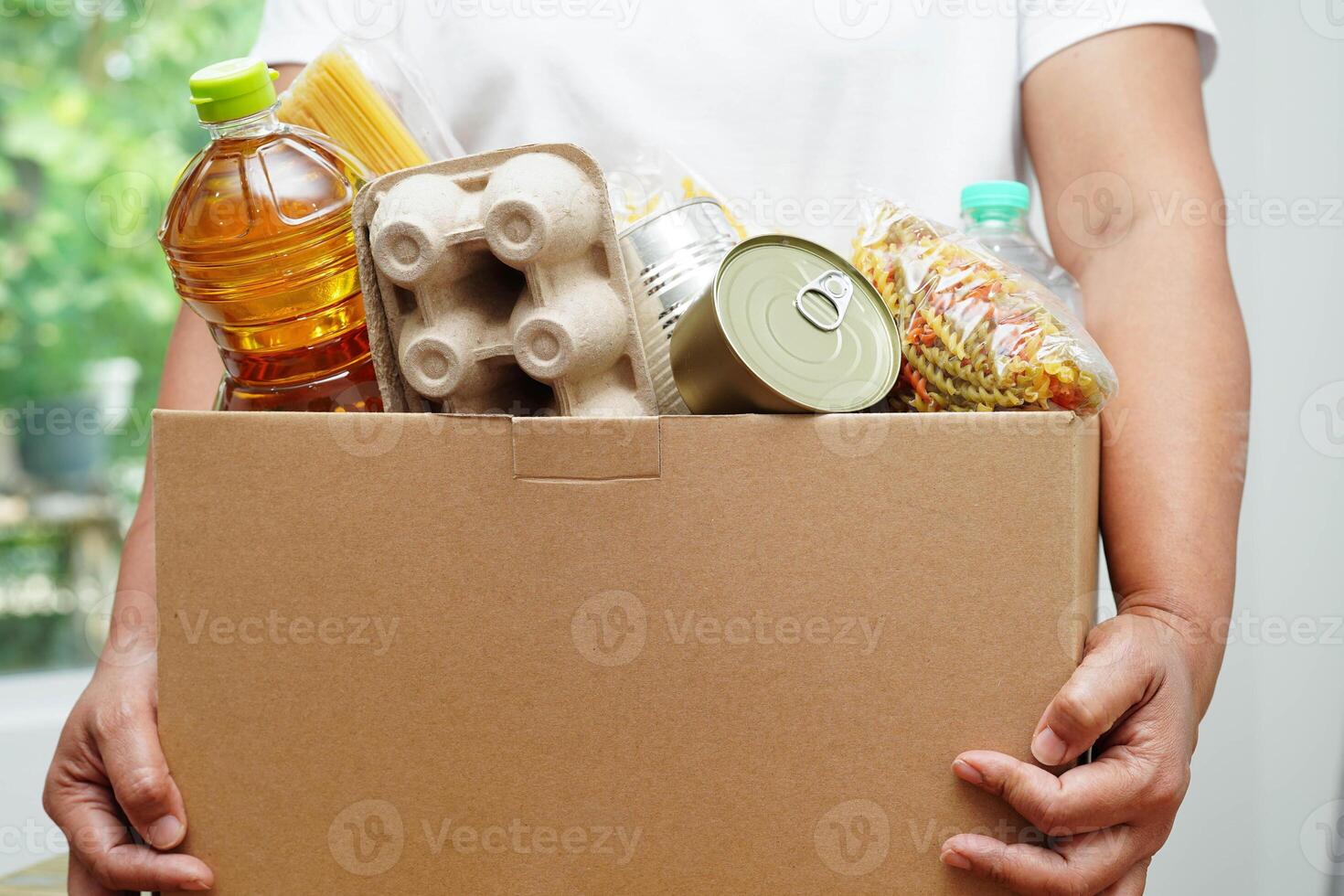 Foodstuffs in donation box for volunteer to help people. photo