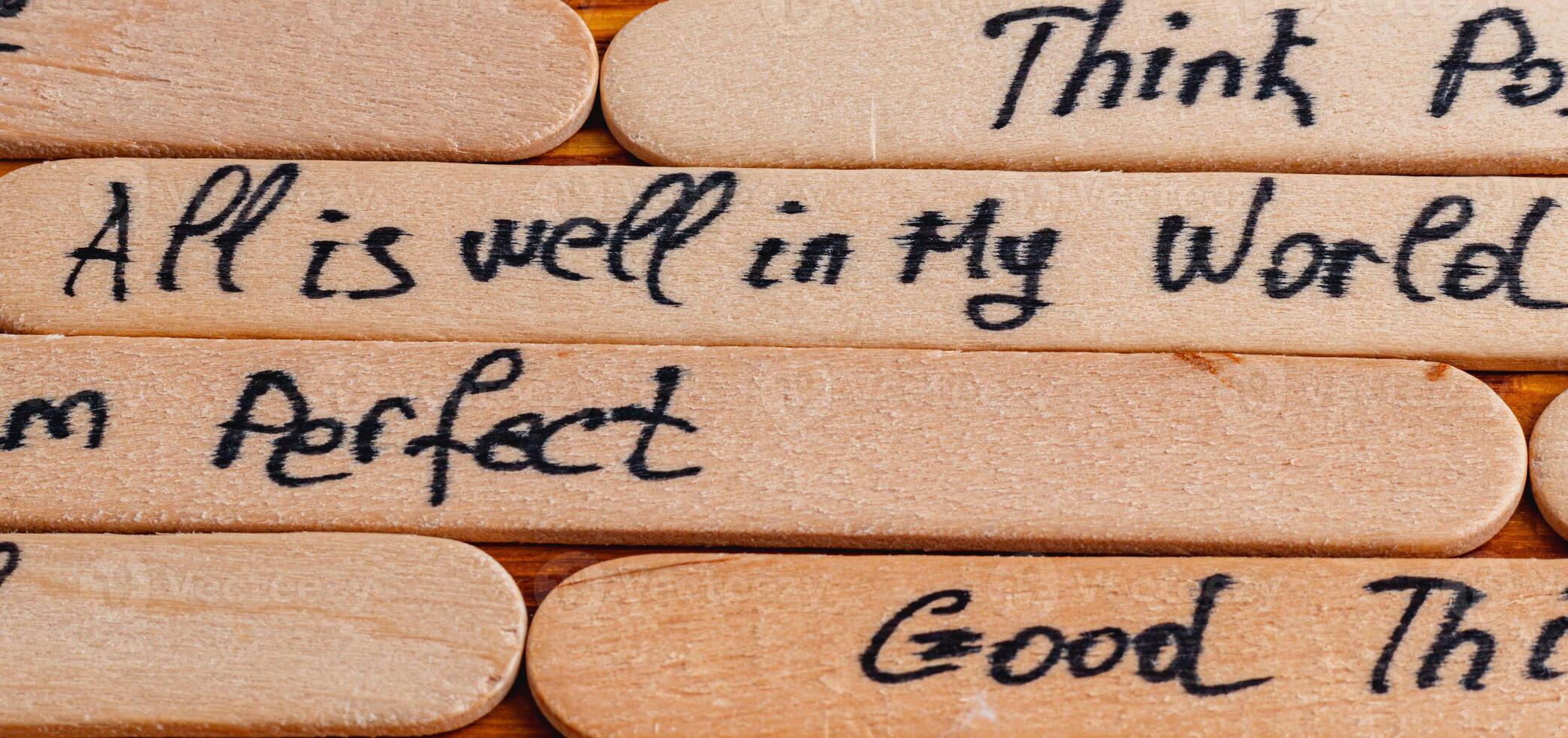 Positive thoughts for increasing selfesteem on wooden posts on wooden background photo