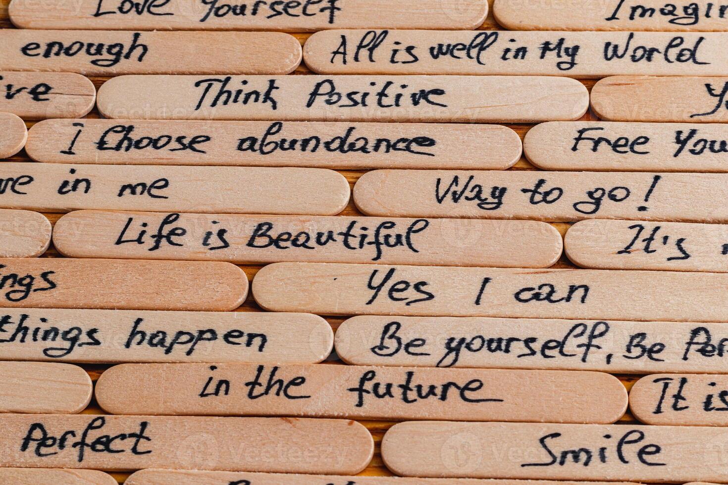 Positive thoughts for increasing selfesteem on wooden posts on wooden background photo