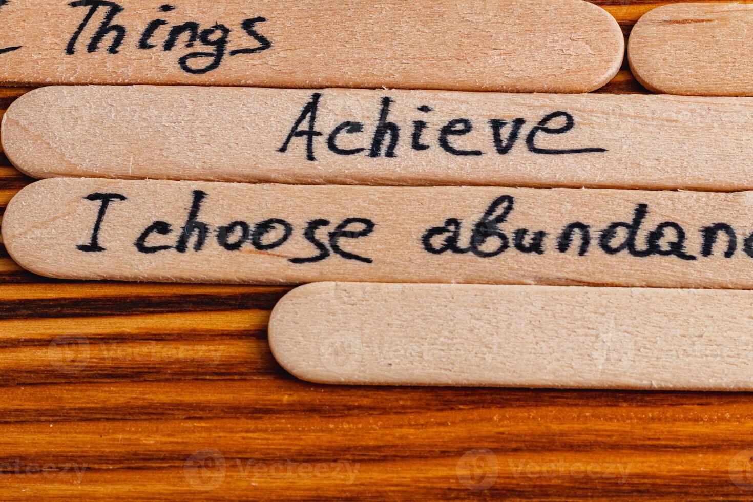 Positive thoughts for increasing selfesteem on wooden posts on wooden background photo