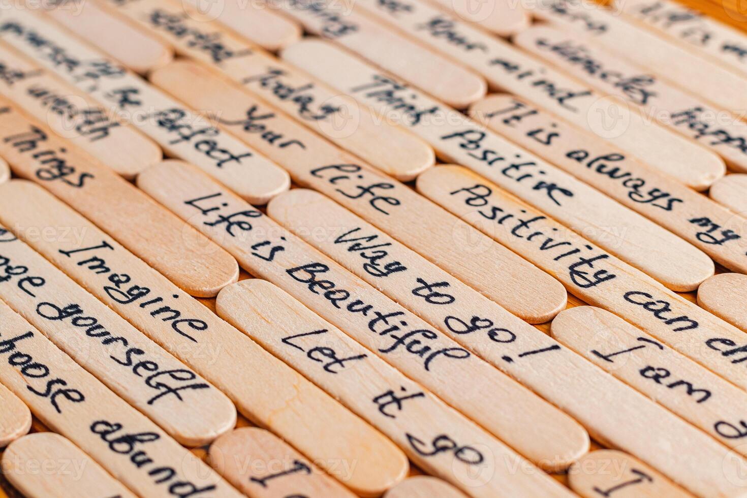 Positive thoughts for increasing selfesteem on wooden posts on wooden background photo