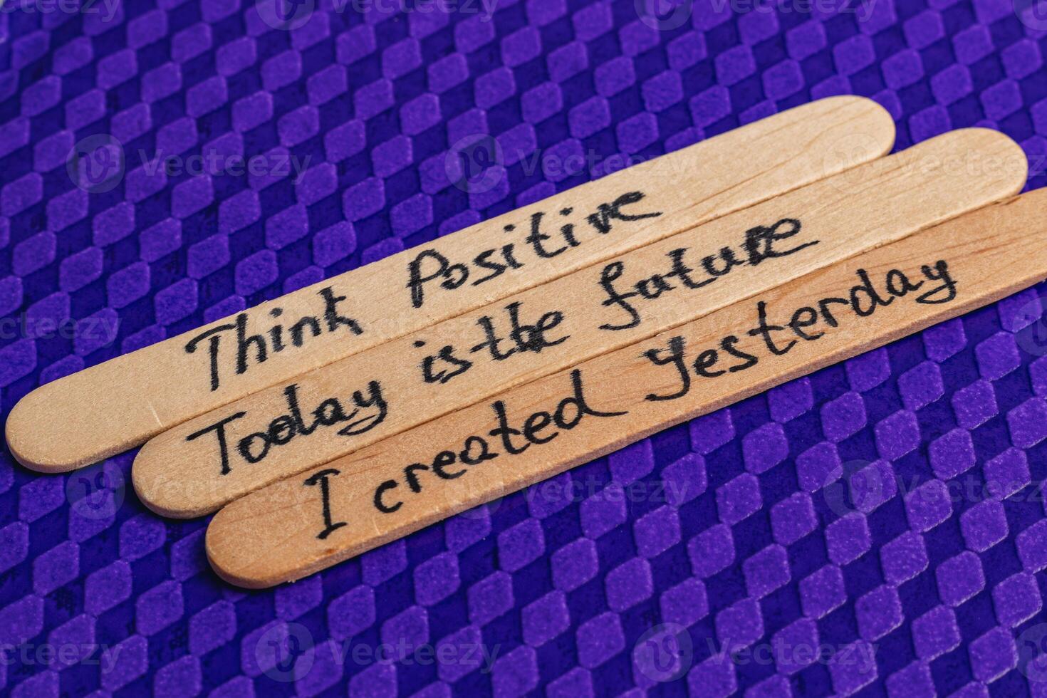 Positive thoughts for increasing self-esteem on wooden posts on blue background photo