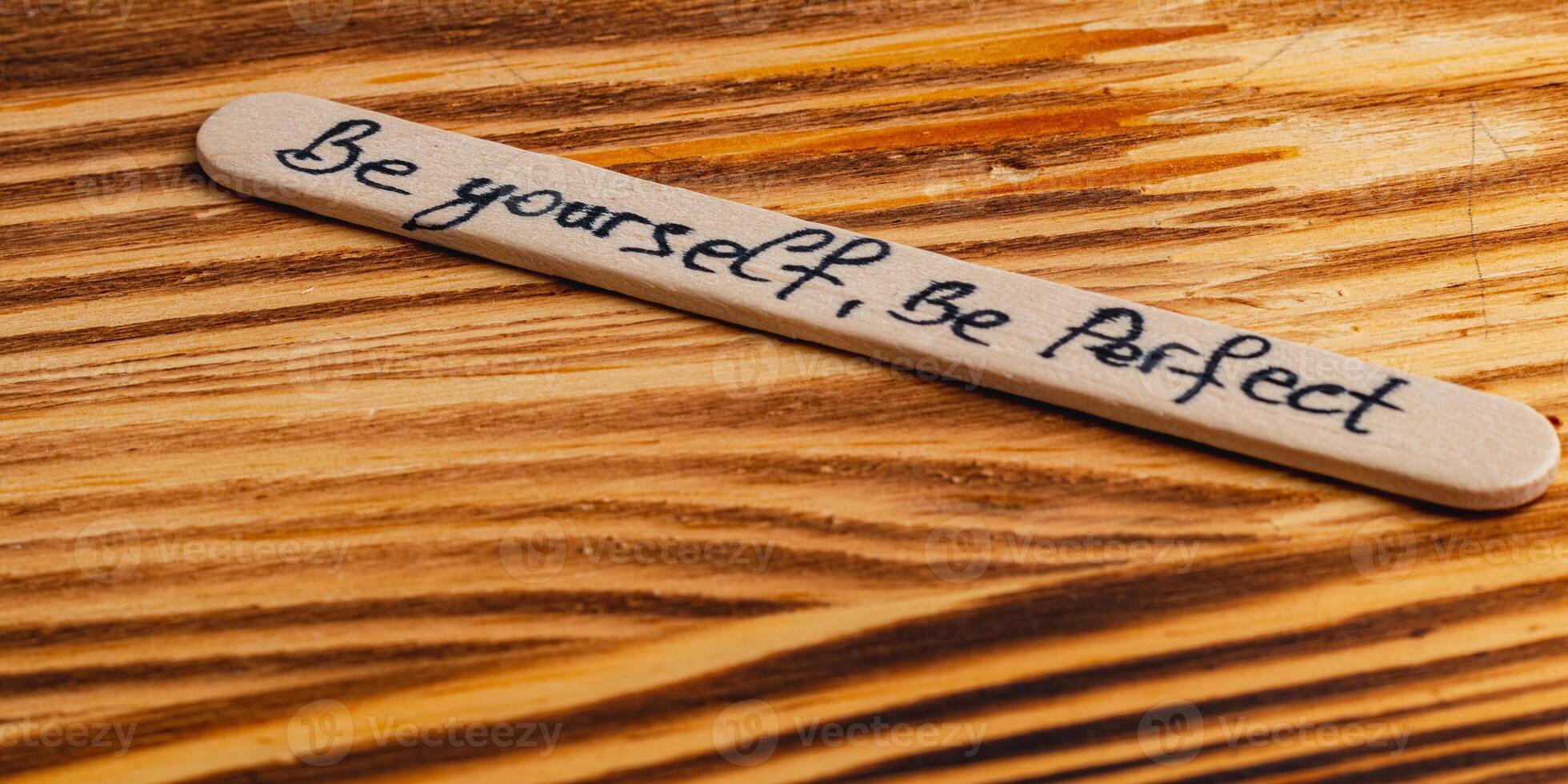 Positive thoughts for increasing selfesteem on wooden posts on wooden background photo