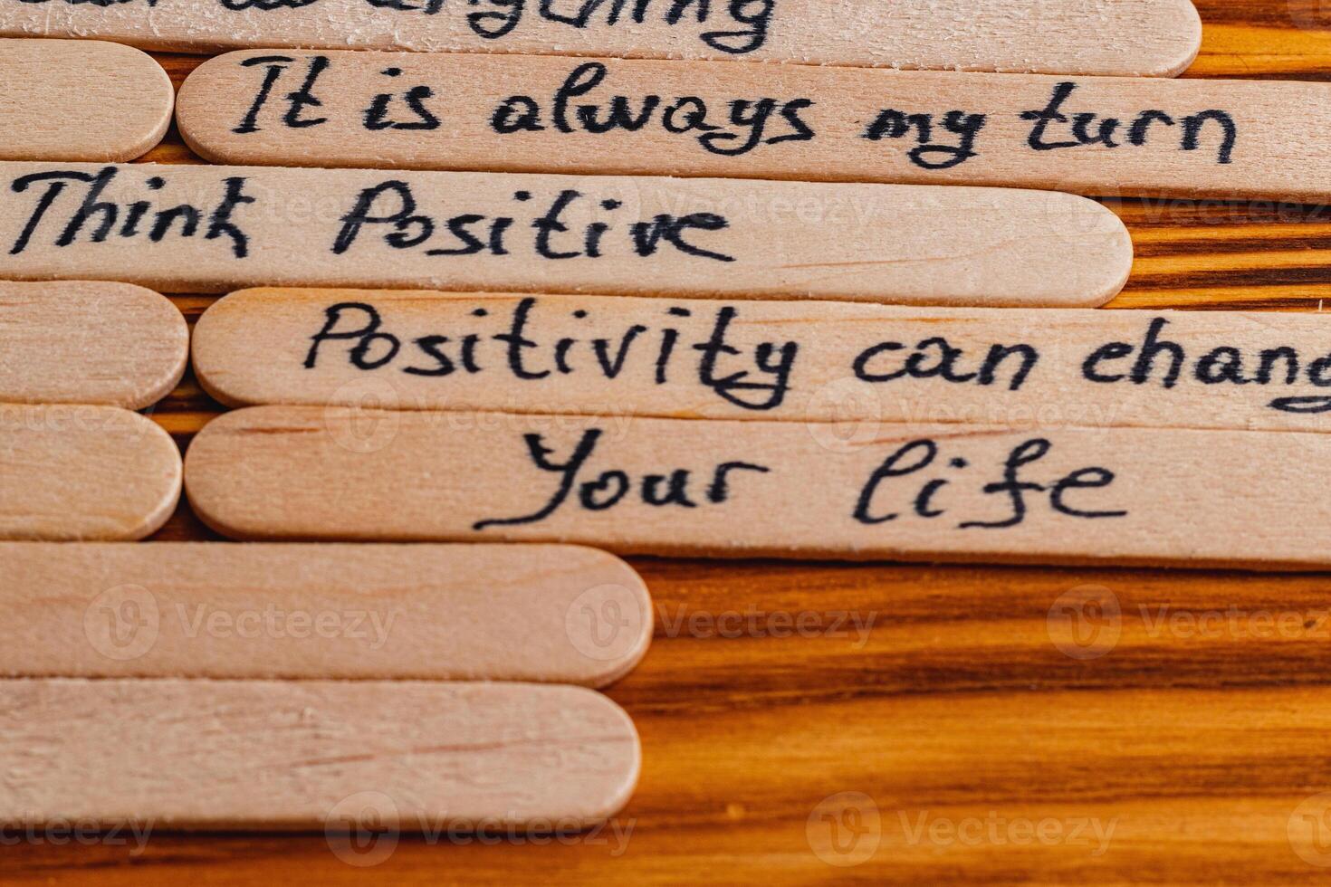 Positive thoughts for increasing selfesteem on wooden posts on wooden background photo