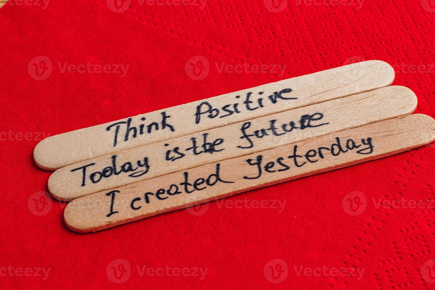 Positive thoughts for increasing self-esteem on wooden posts on red background photo