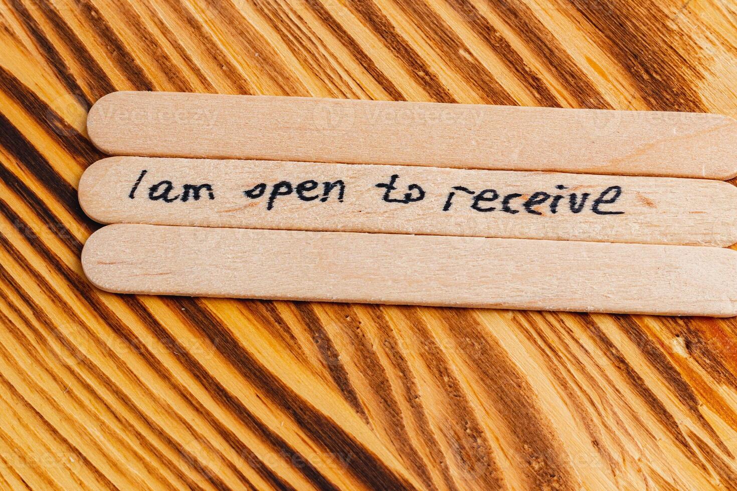 Positive thoughts for increasing selfesteem on wooden posts on wooden background photo