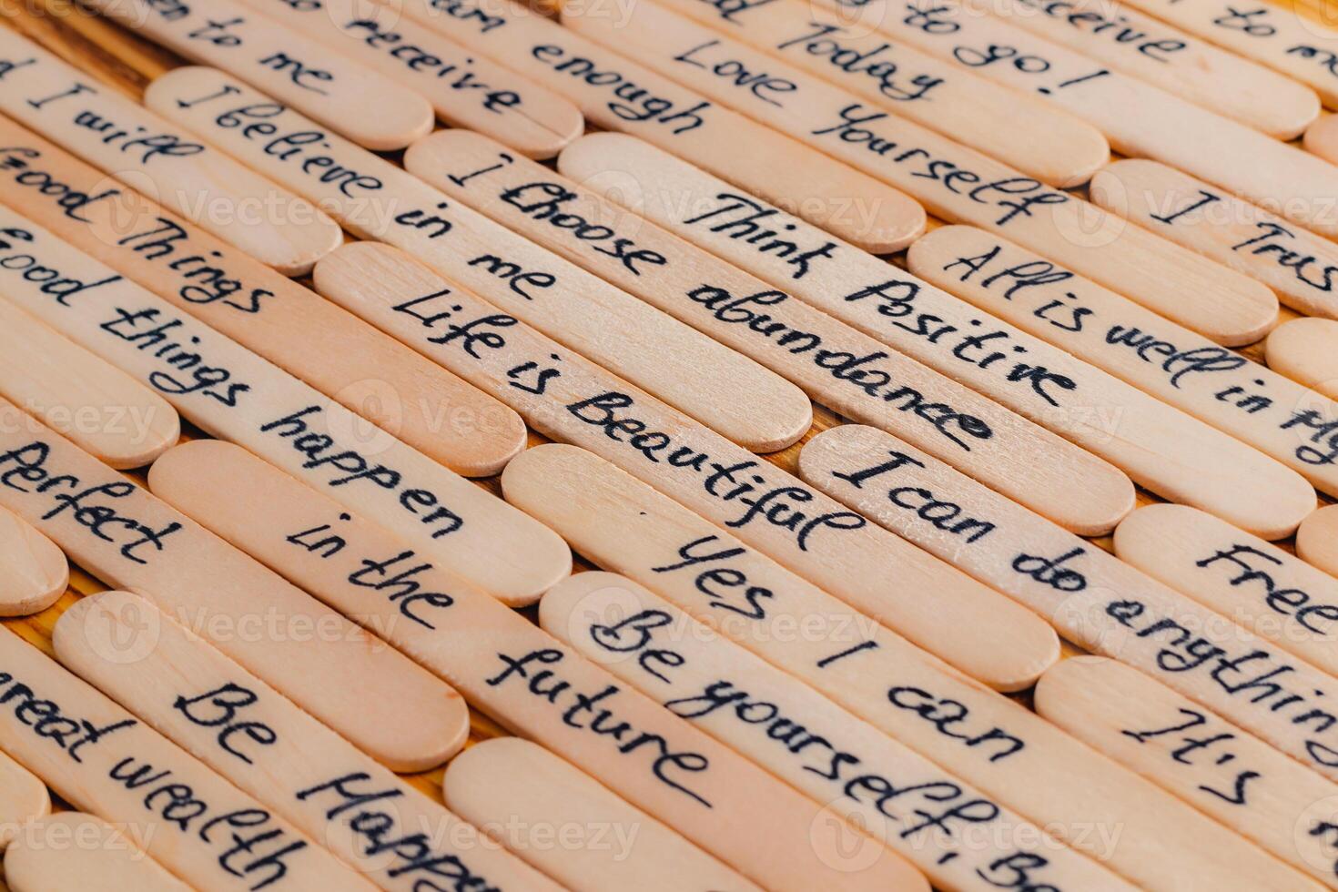 Positive thoughts for increasing selfesteem on wooden posts on wooden background photo