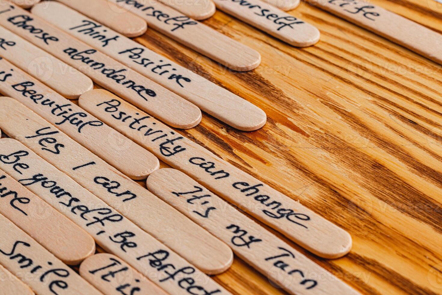 Positive thoughts for increasing selfesteem on wooden posts on wooden background photo