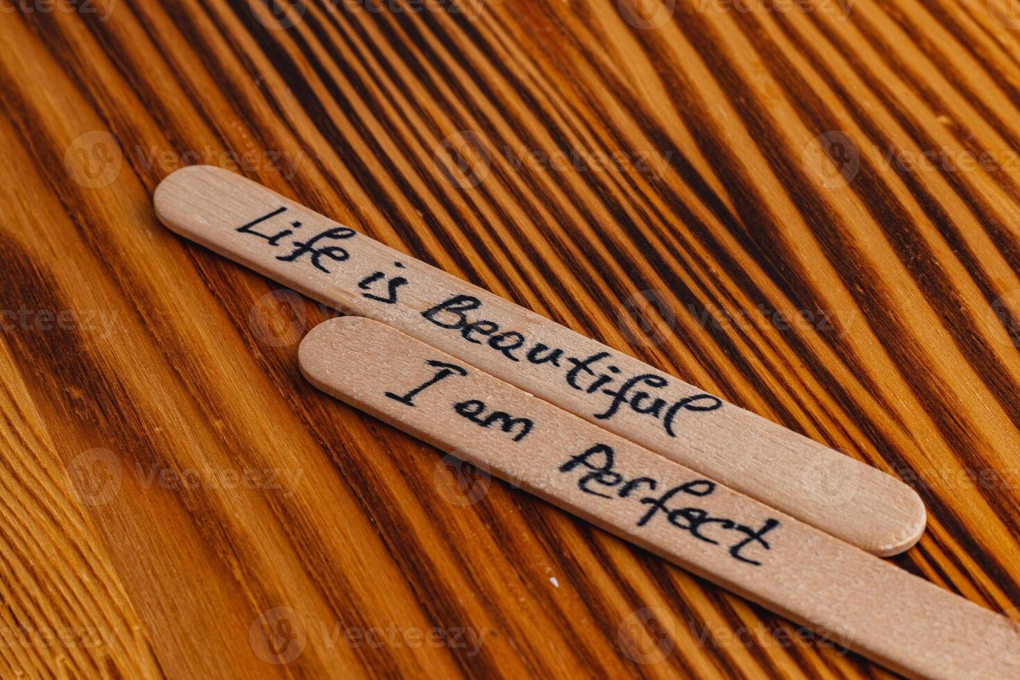 Positive thoughts for increasing selfesteem on wooden posts on wooden background photo