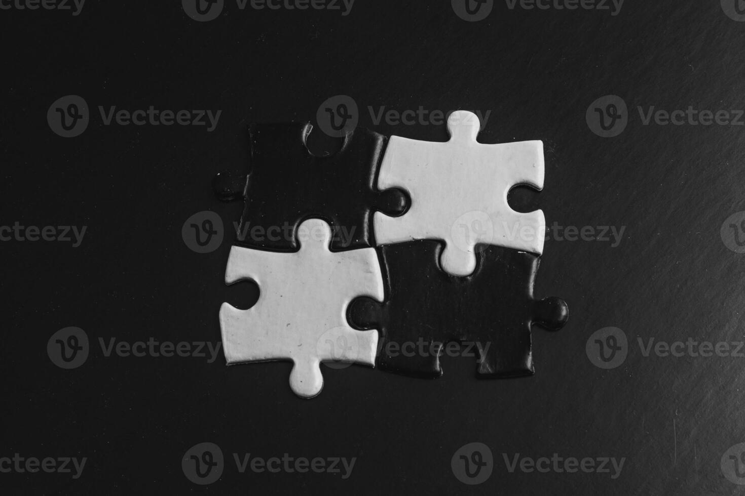 Opposite day concept,white and black puzzle pieces with oposite background color photo