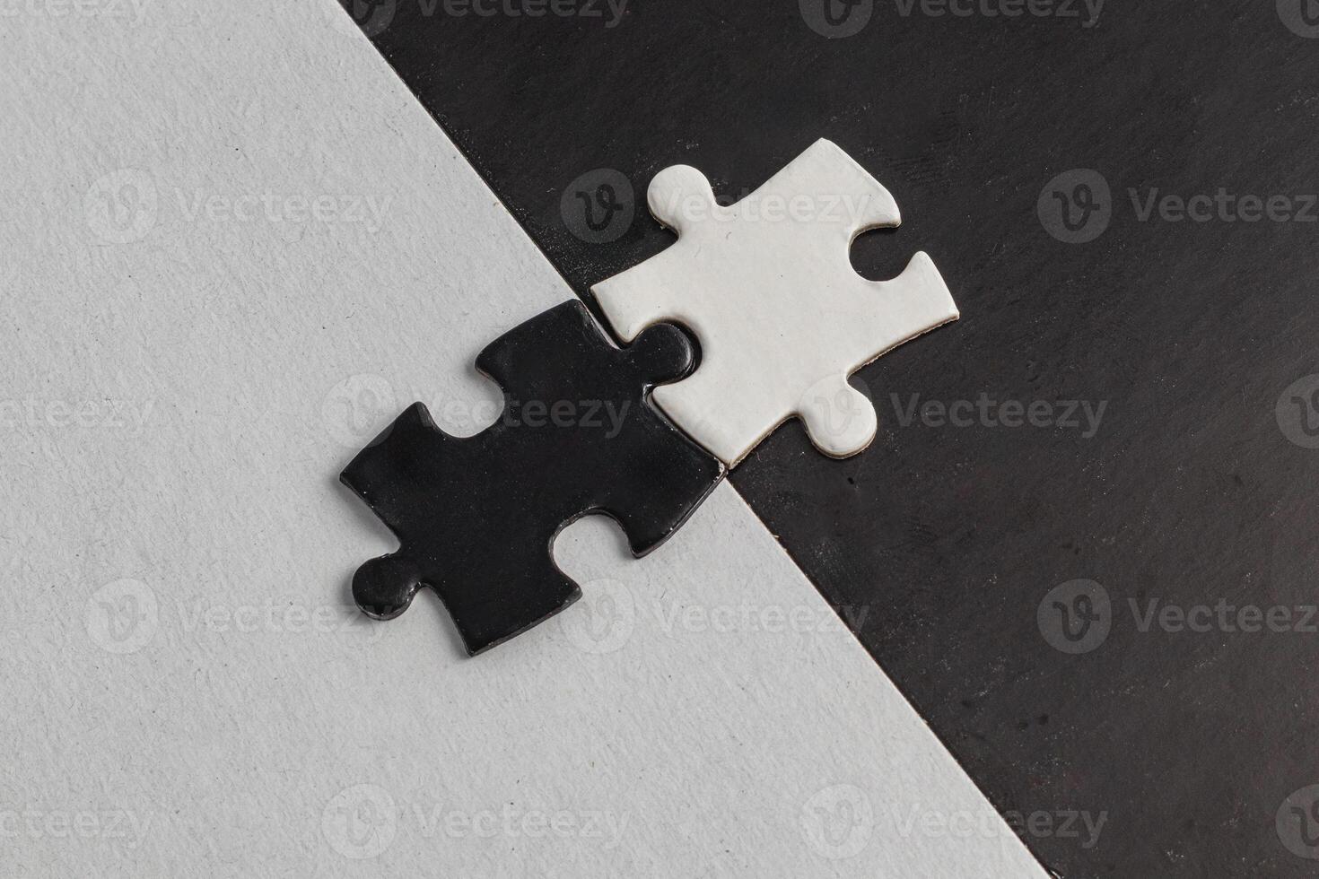 Opposite day concept,white and black puzzle pieces with oposite background color photo