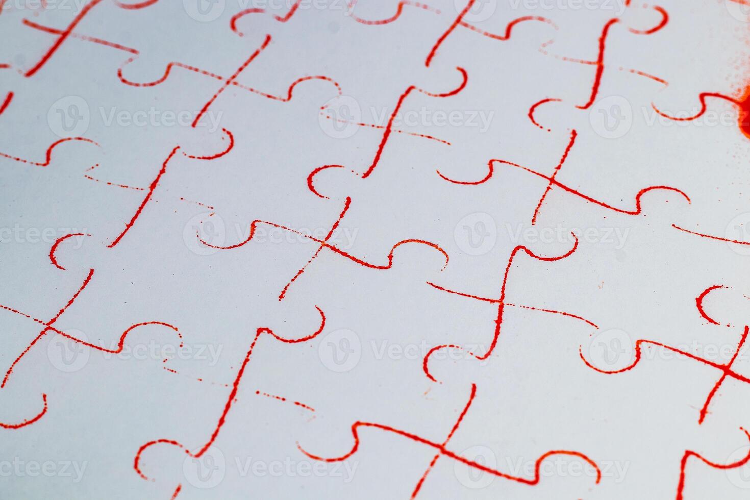 Love concept. Heart puzzle print on white cardboard on red background photo