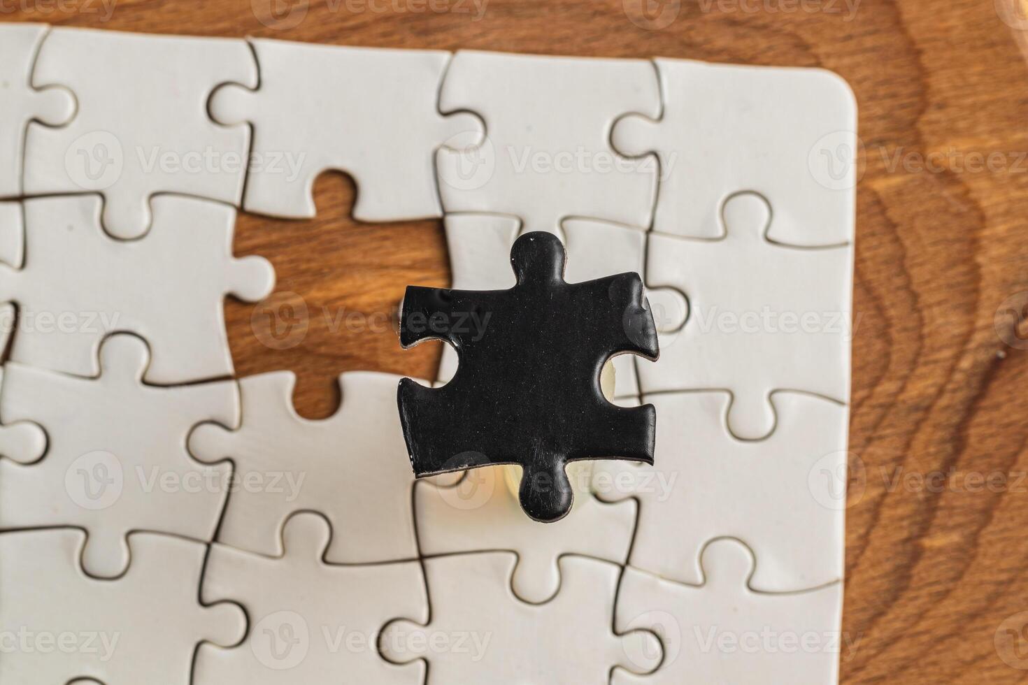 Opposite day concept using white and black puzzle pieces on a white background photo