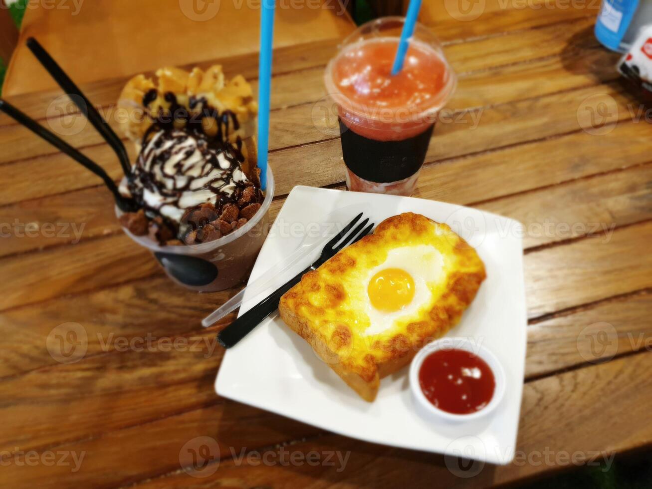 Delicious breakfast spread featuring egg toast and desserts at local cafe indoor setting food photography culinary delight photo