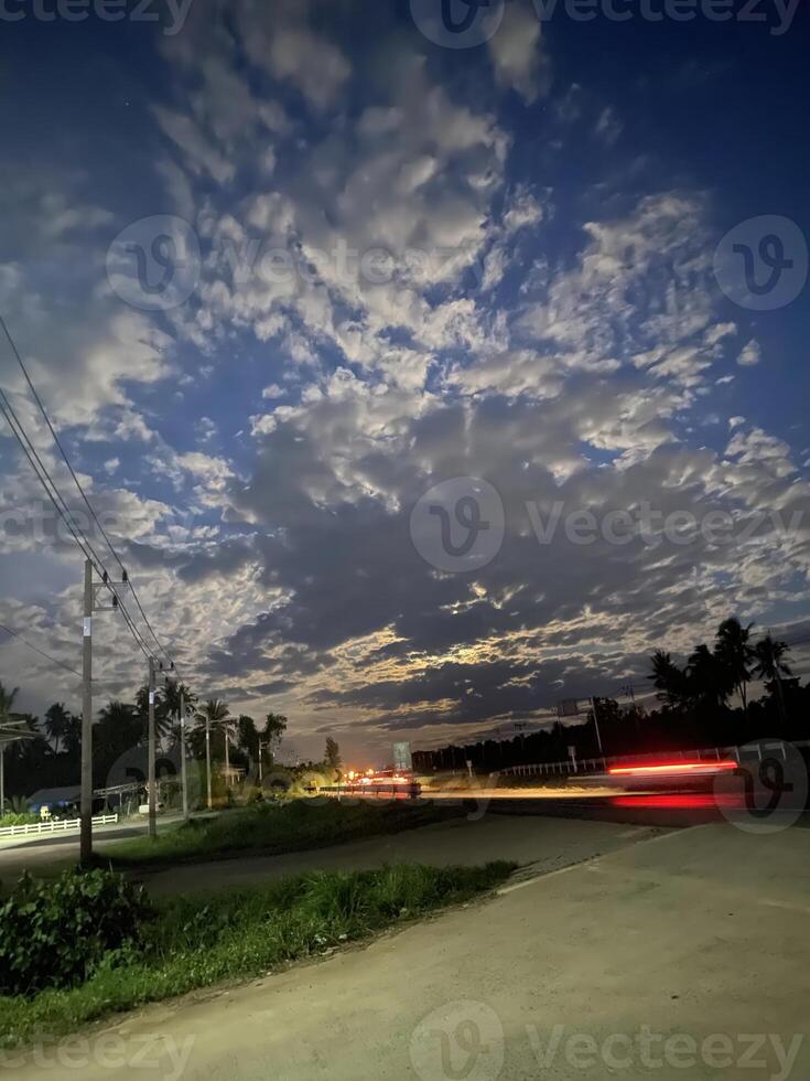 Evening sky transformation rural road nature photography serene environment aerial view tranquility and change photo