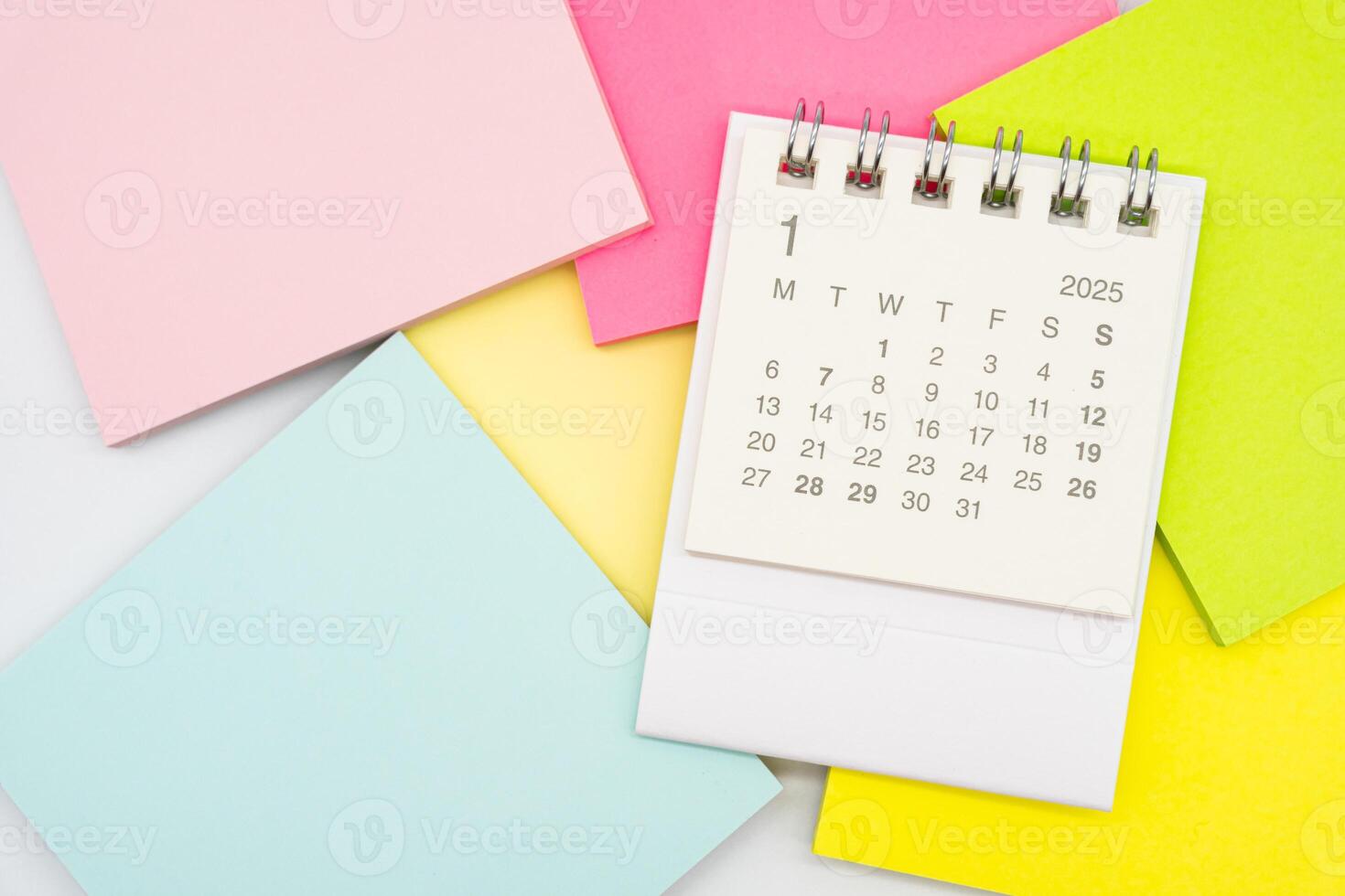 Simple desk calendar for JANUARY 2025 with office supplies. Calendar concept with copy space. 2025 JAN calendar. photo