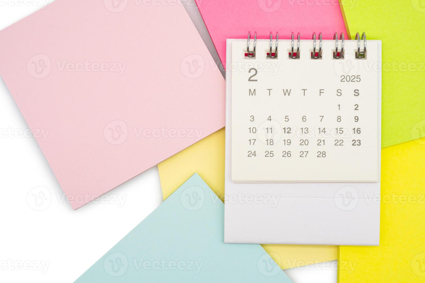 Simple desk calendar for FEBRUARY 2025 with office supplies. Calendar concept with copy space. 2025 FEB calendar. photo