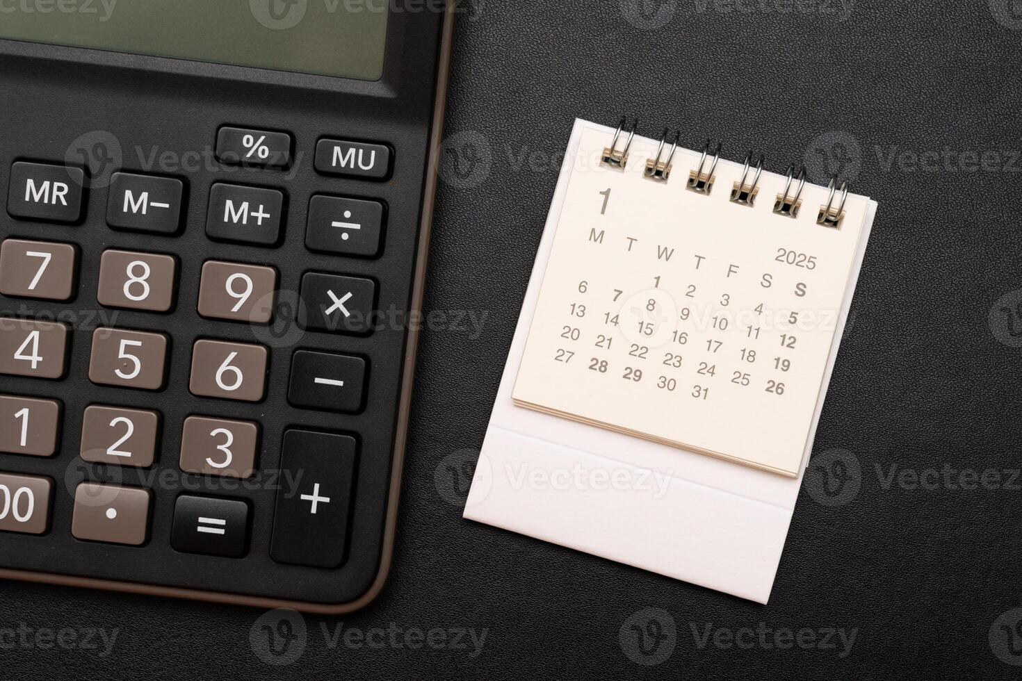 Simple desk calendar for JANUARY 2025 with office supplies. Calendar concept with copy space. 2025 JAN calendar. photo