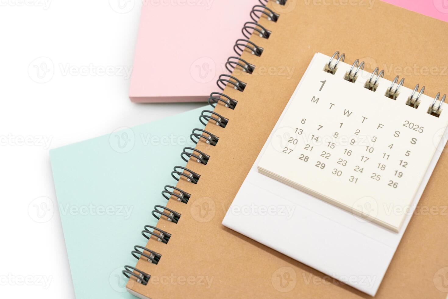 Simple desk calendar for JANUARY 2025 with office supplies. Calendar concept with copy space. 2025 JAN calendar. photo