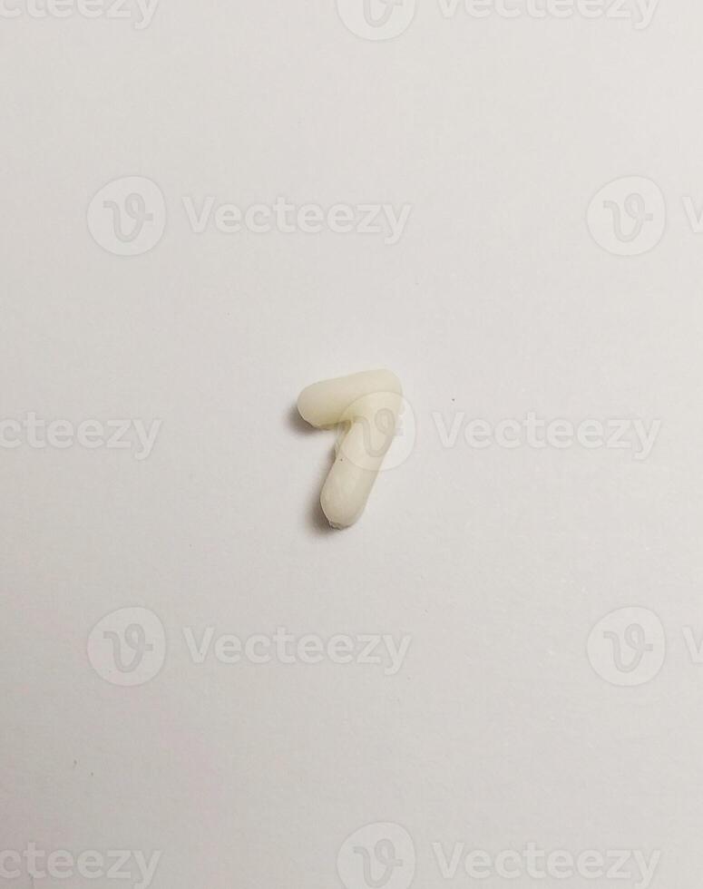 miniature cute handmade clay isolated sculpture number white seven photo
