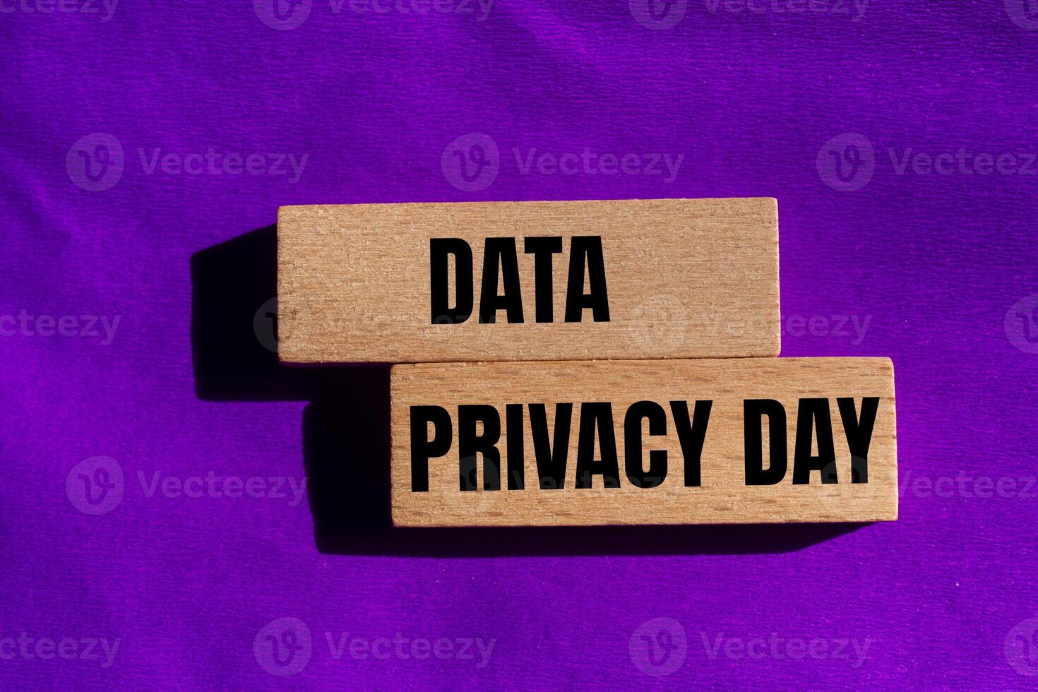Data privacy day message written on wooden blocks with purple background. Conceptual data privacy day symbol. Copy space. photo