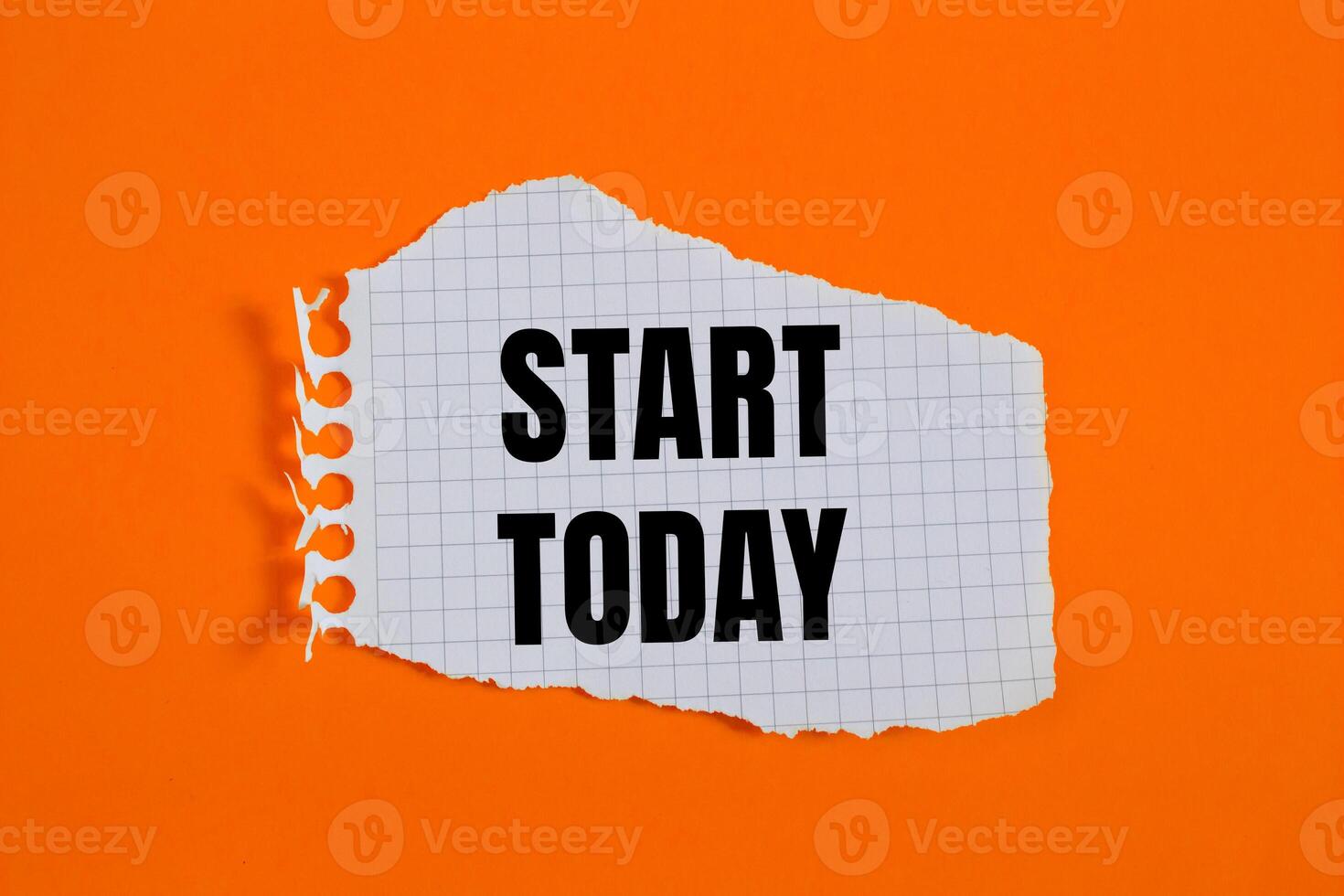 Start today message written on ripped torn checkered graph paper piece with orange background. Conceptual start today symbol. Copy space. photo