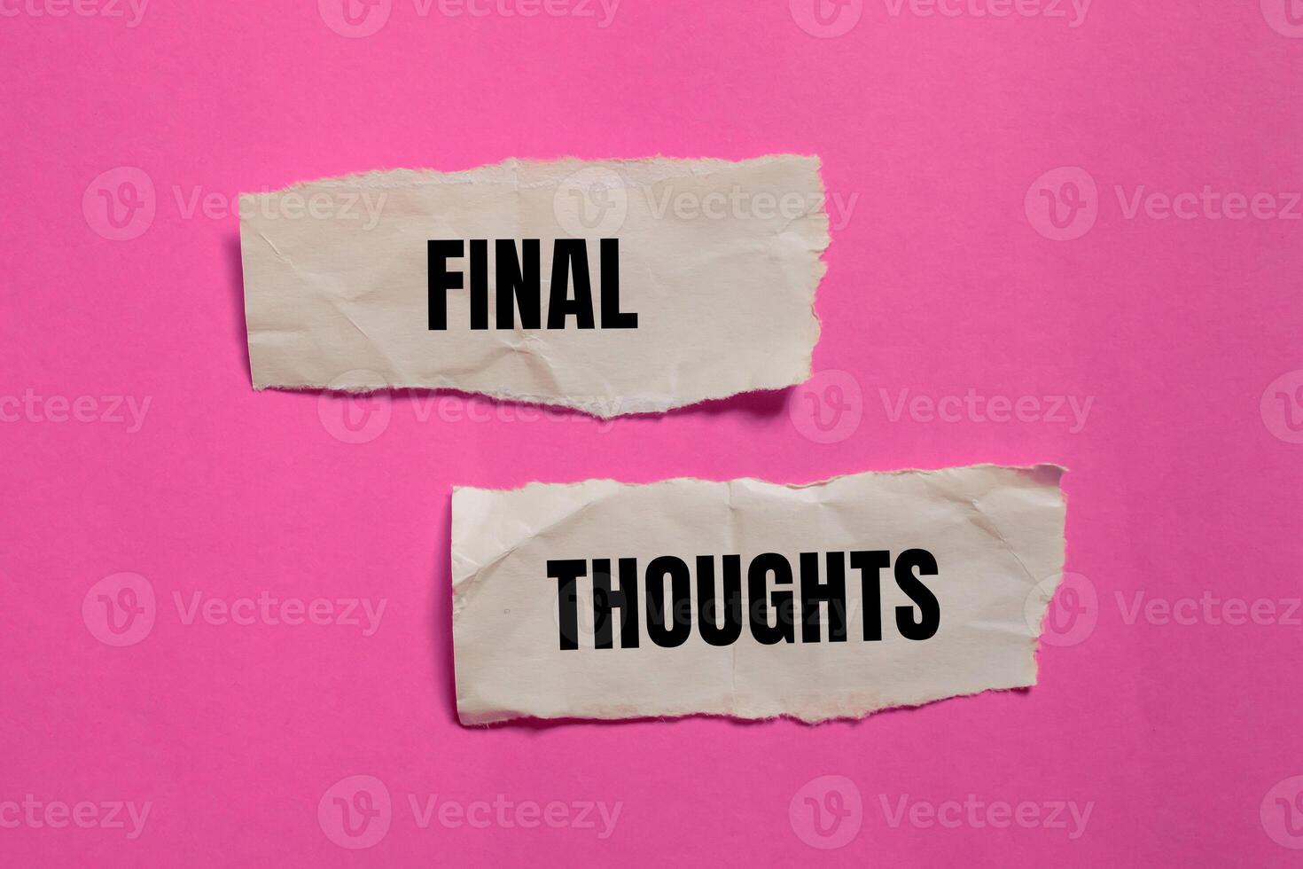 Final thoughts message written on ripped paper pieces with pink background. Conceptual final thoughts symbol. Copy space. photo