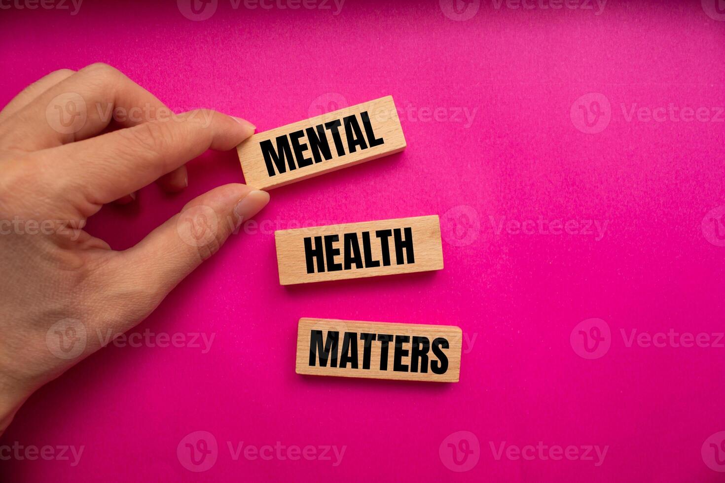Mental health matters message written on wooden blocks with pink background. Conceptual mental health matters symbol. Copy space. photo