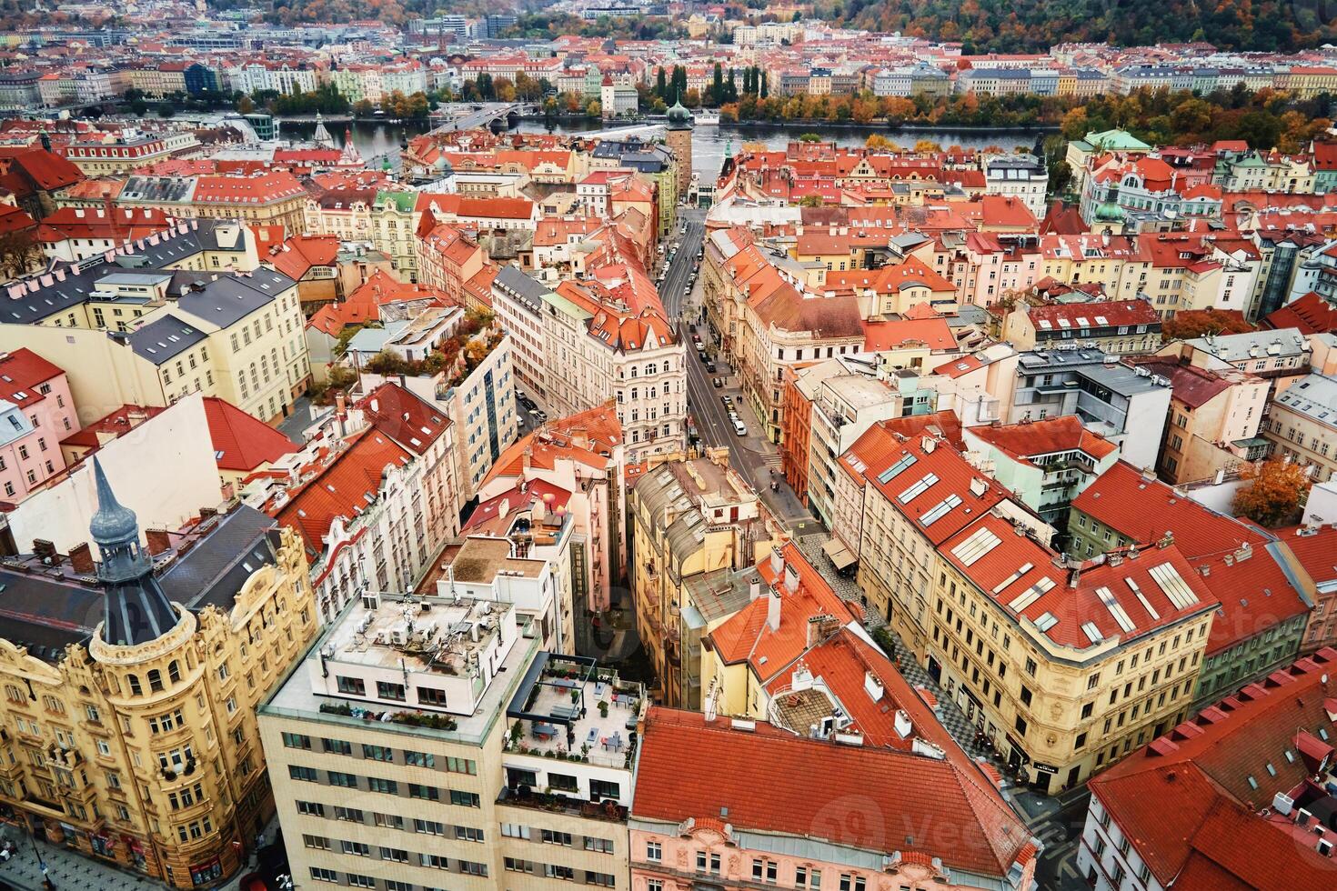 Prague architecture, aerial view. Historical buildings with red roofs in European city. Birds eye view of cityscape of Praha, Czech Republic photo