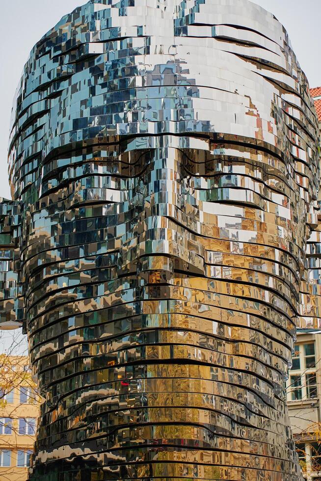 Rotating head of Franc Kafka, art installation in Prague. Metal sculpture made by David Cerny. Contemporary art installation at street. Prague, Czech Republic - October 27, 2024 photo