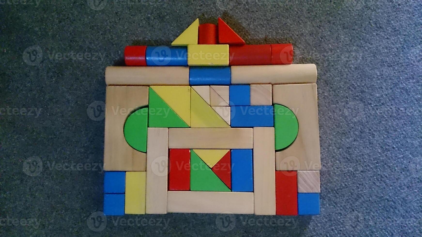 A wooden block with a colorful design on it photo