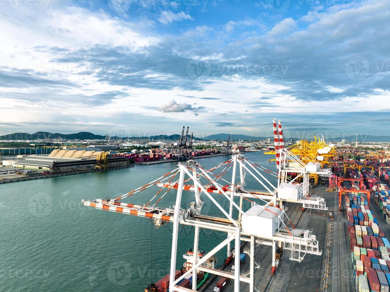 Logistics and transportation of container cargo ship at ship port. Container truck and crane bridge in shipyard. Import export and transport industry. Terminal port for export transport by ship. photo