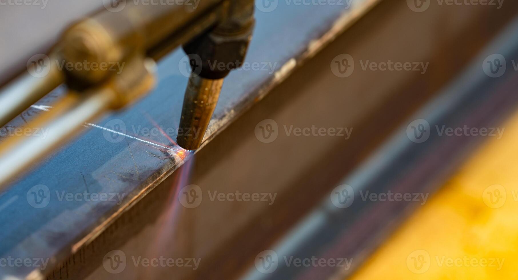 Metal being cut with a torch. Gas cutting metal. Precision and control in metal fabrication process. Sparks fly as flame. Clean, sharp cut. Metalwork and welding. Industrial metal cutting process. photo