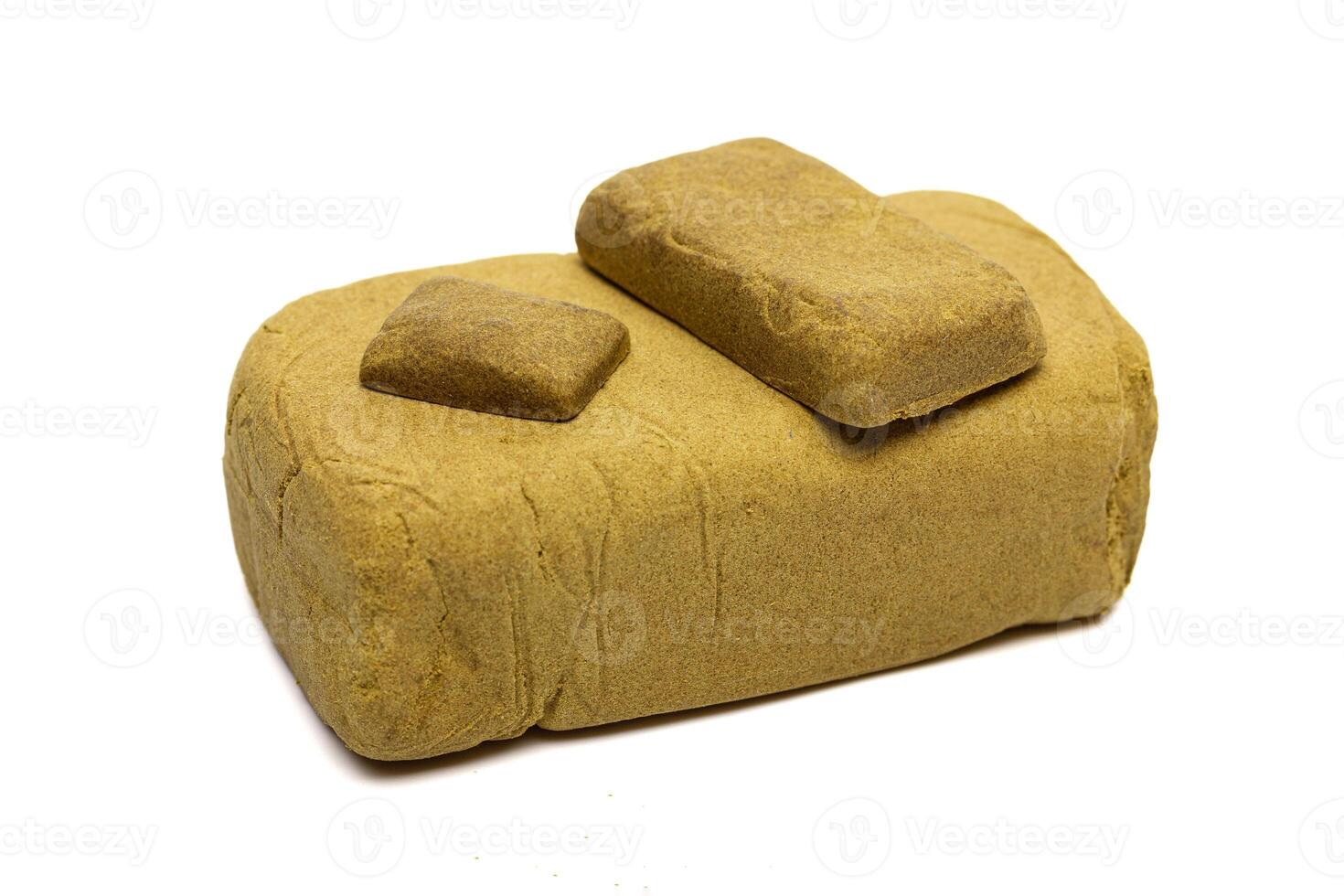 Blocks of hashish isolated on white background photo