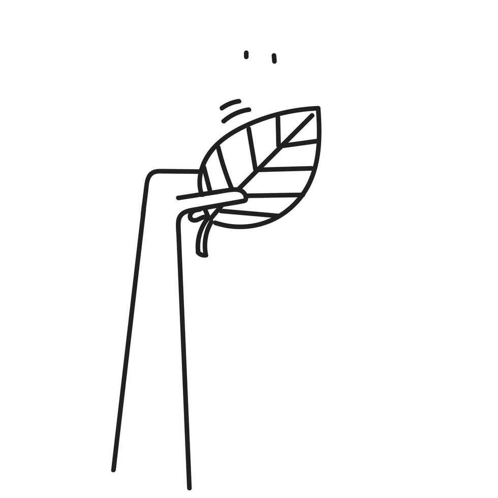 a hand holding a leaf in the air vector