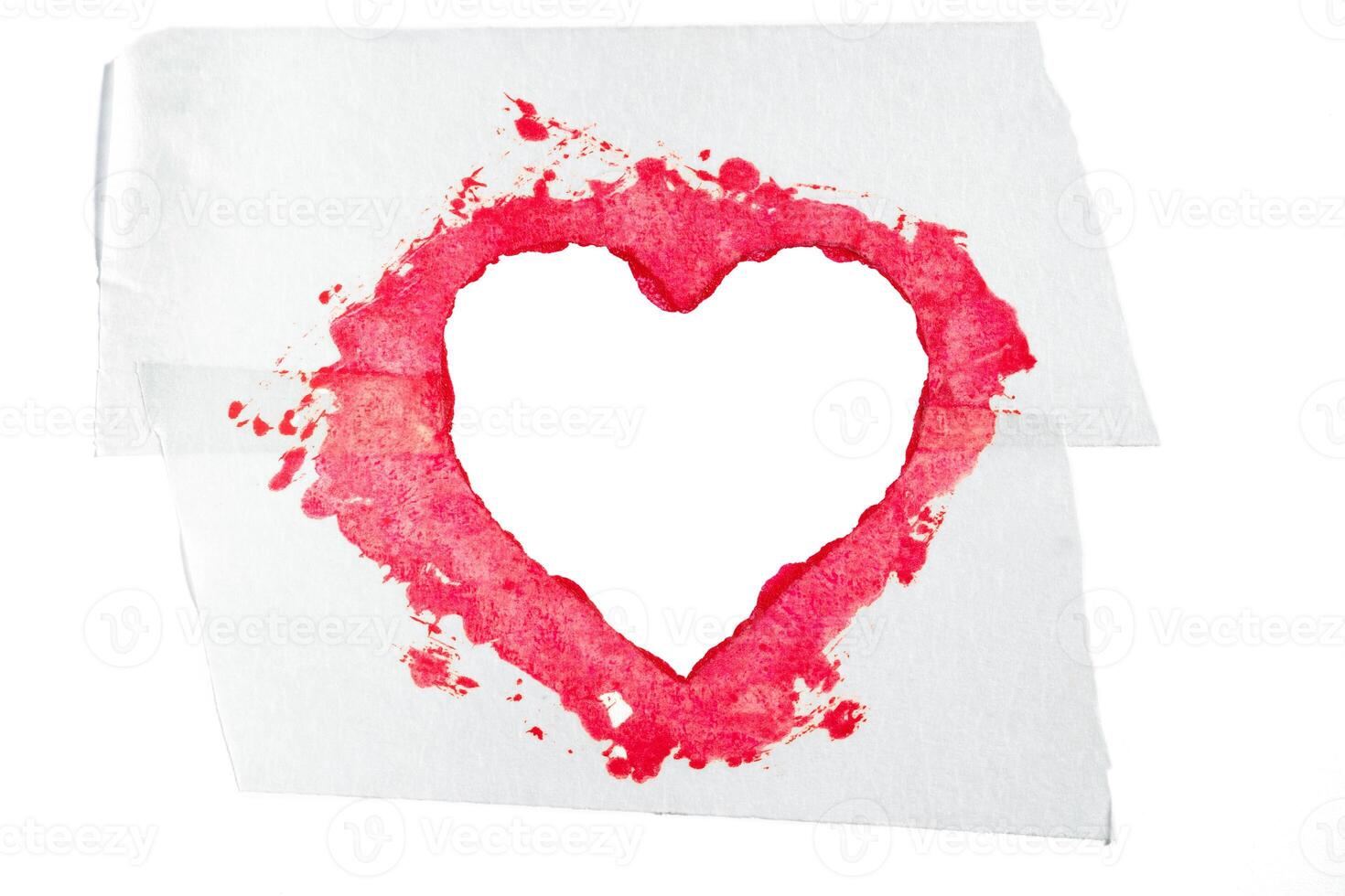Isolated red lipstick smudge smear heart shaped. Heart care photo