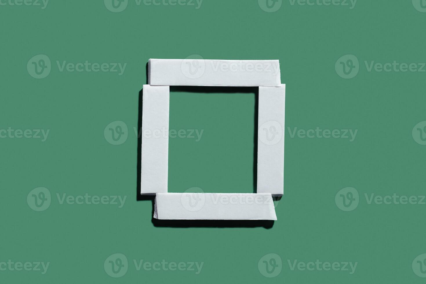 Double sided tape frame on green background. Design element for holiday sale banner photo