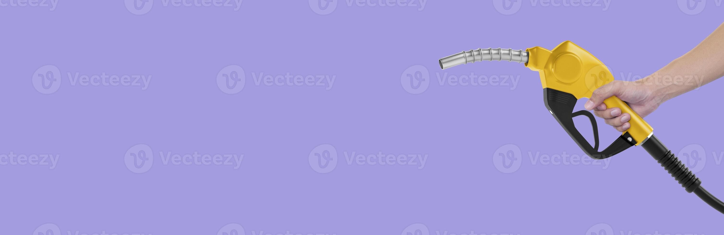 Hands holding Fuel nozzle on light purple background photo