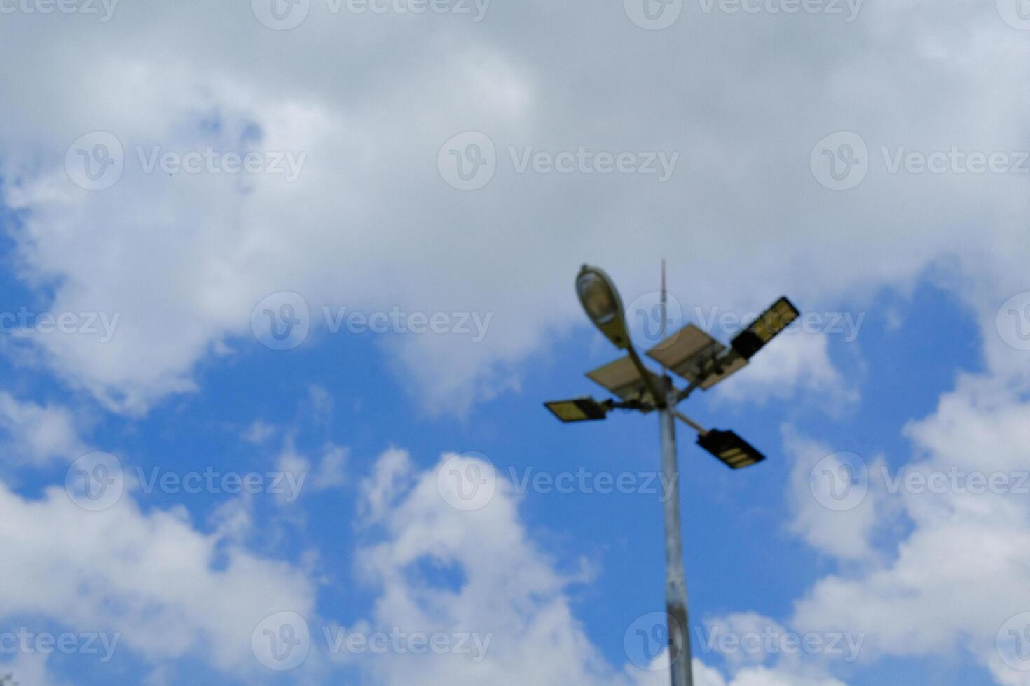 Textured Backgrounds of four-way lights at a crossroads. Public Facilities. Park and street lights. Modern LED Lights. Wallpapers Backgrounds. Lamppost with cloudy sky background photo
