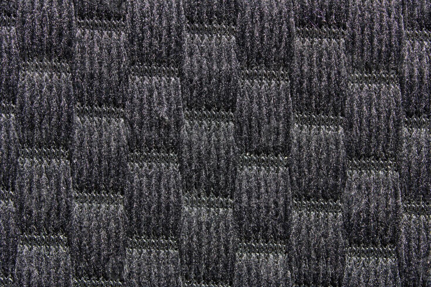 Close up of carbon fiber texture with checkered pattern in black and gray. photo