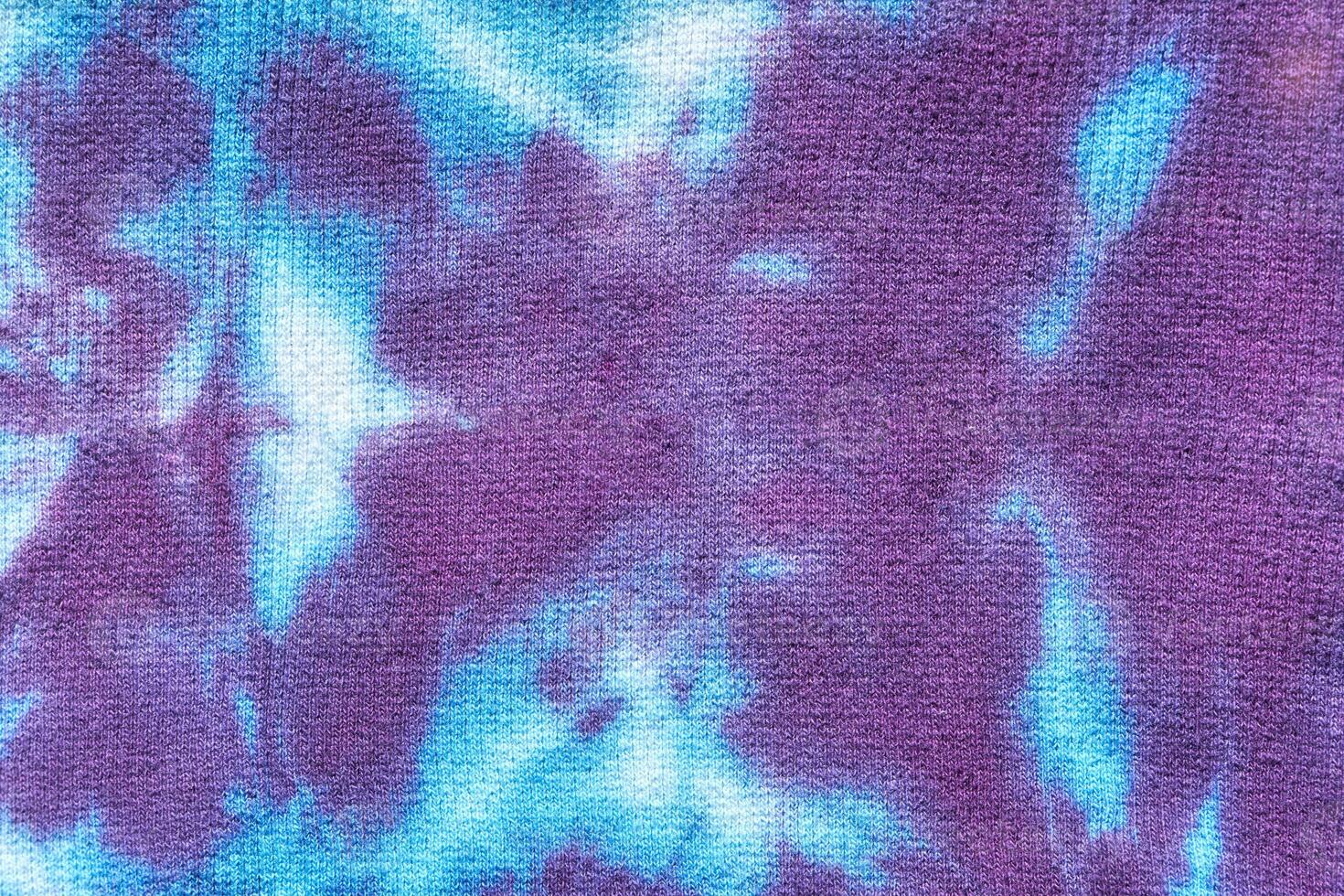 Vivid blue and purple abstract tie dye pattern with soft texture and blended colors. photo
