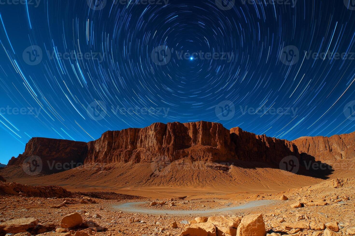 Star trails swirl North Star desert landscape captured long exposure night photo