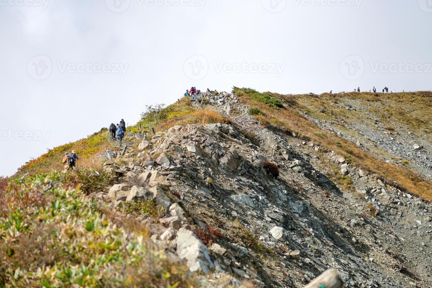 Happo Alpen Line Nature trail, Hakuba, Nahano, Japan, Hikers climbing a rocky hillside photo