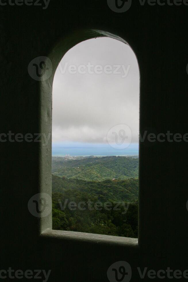 Mountain and sea view from frame of window photo