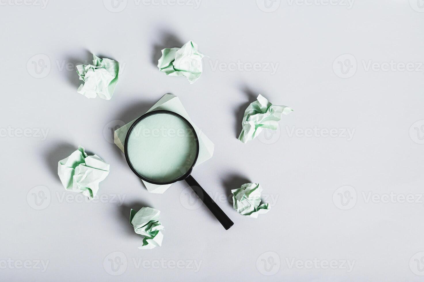 Burnout breaks concept. Magnifier among the papers for writing on the desk top view photo