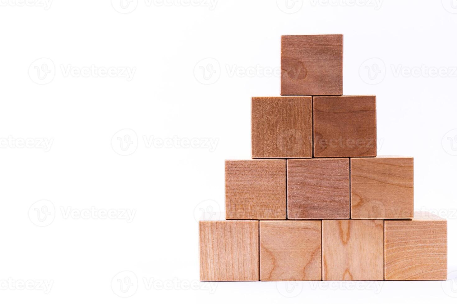 Wooden cubes in the form of a pyramid. Financial pyramid. copy space. photo