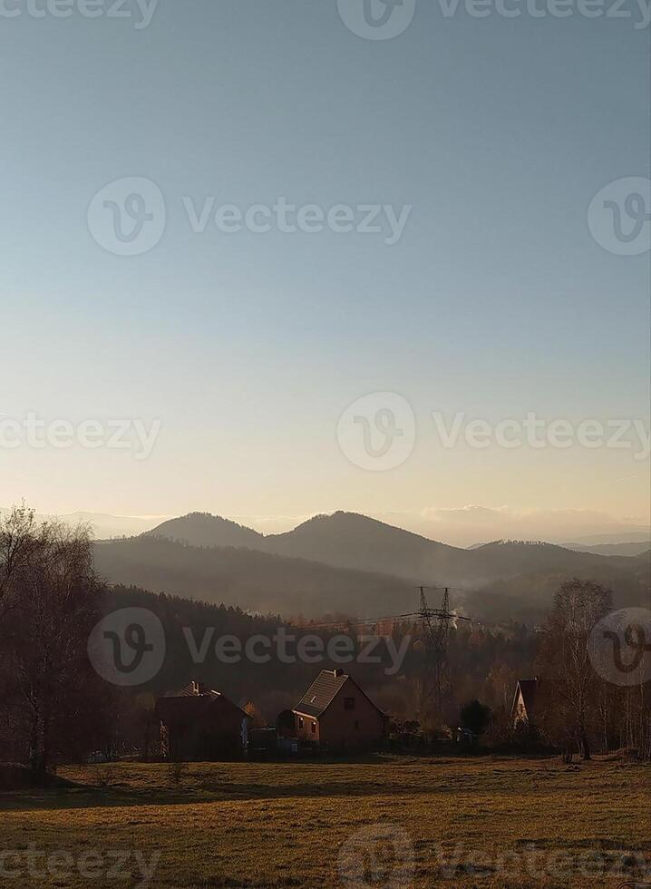 Autumn sunset in the mountains, autumn mountains, view from the top of the mountain. Sudetes, Poland photo