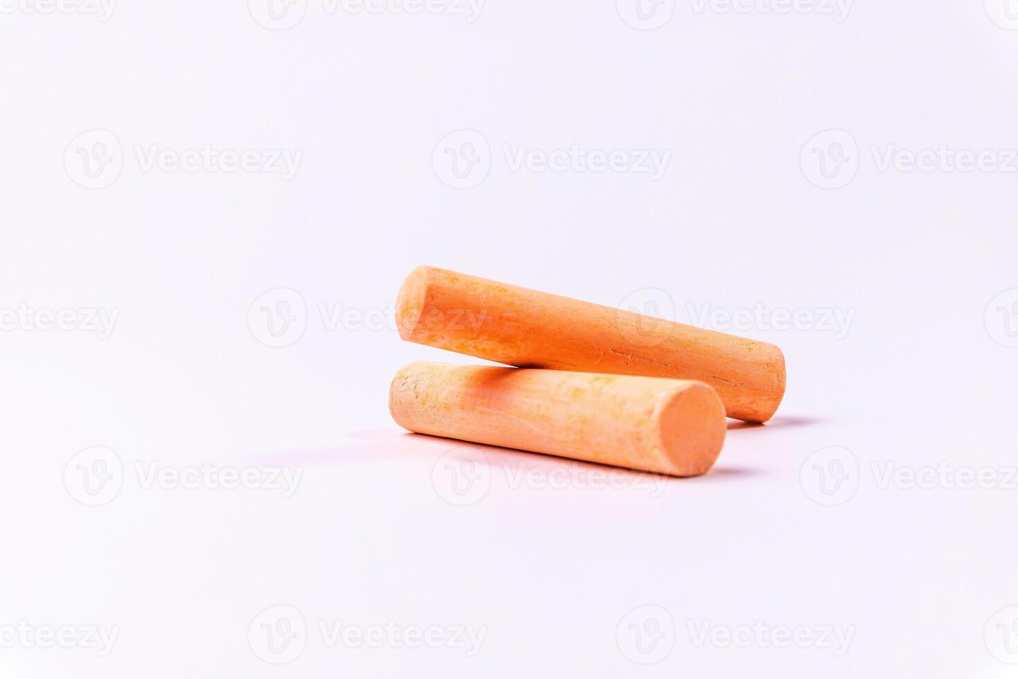 Crayons of different colors arranged on a white background. Education photo