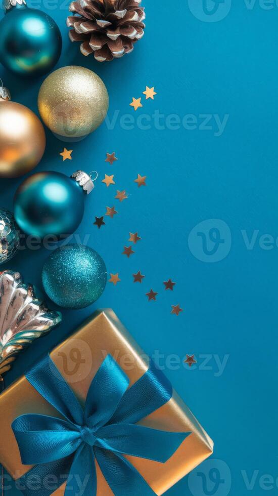 Light Blue and Gold Christmas Arrangement with Gift Box and Baubles on Light Blue Background. Elegant, Festive Christmas Banner, Template, Copy Space, Social Media Post photo